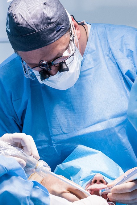 Dentists performing a dental implant surgery