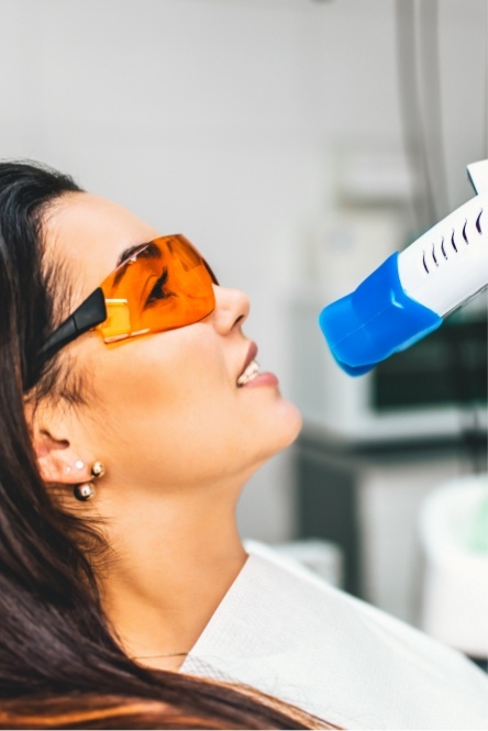 Woman receiving in office teeth whitening