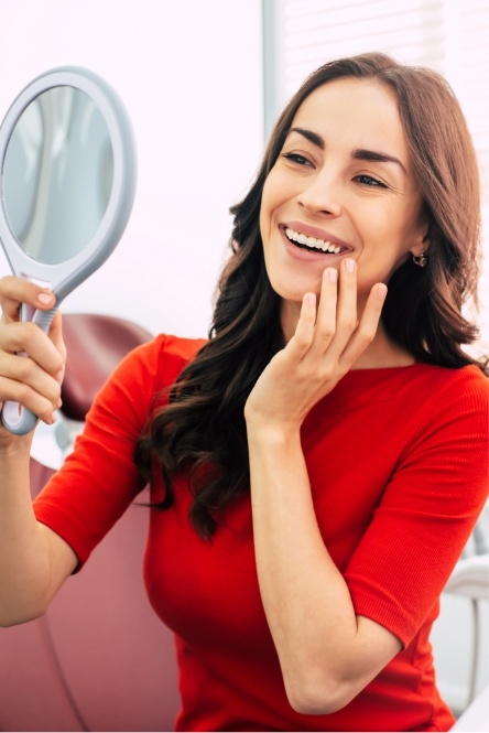 Woman admiring her smile after makeover