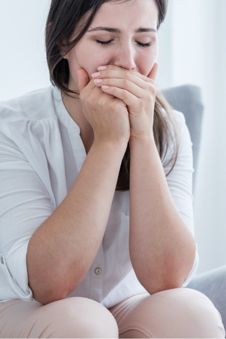 Woman in pain before emergency dentistry