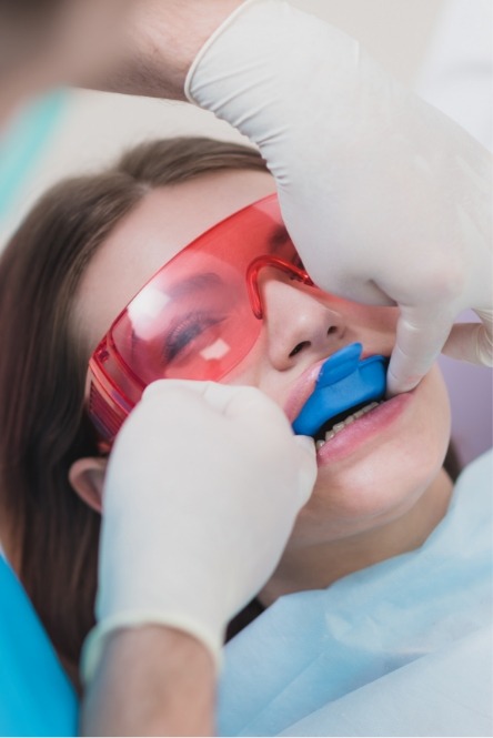 Dental patient receiving fluoride treatment