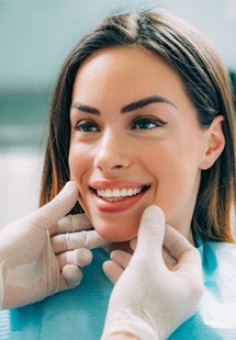 patient smiling while looking at dentist