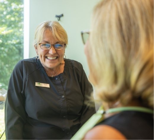 team member smiling at patient