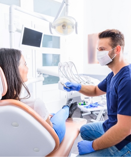 Dentist talking to dental patient