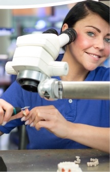 Dental technician crafting dental restorations