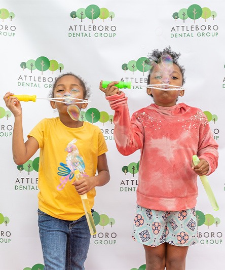 Two kids in North Attleboro blowing bubbles