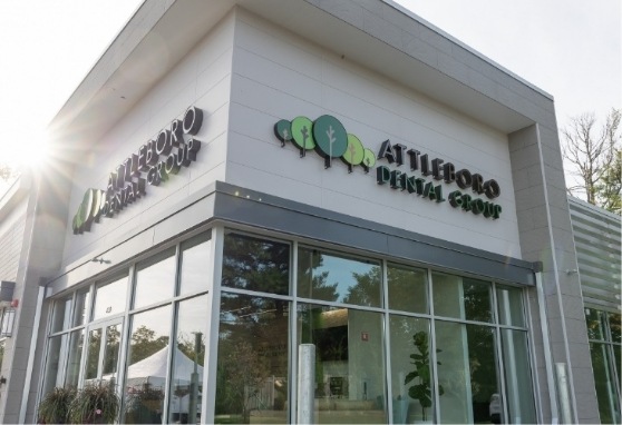 Exterior of Attleboro Dental Group building with the sun shining