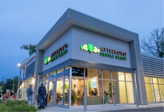 Front exterior of Attleboro Dental Group at dusk