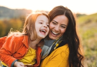 Mother and child smiling after preventive dentistry visit