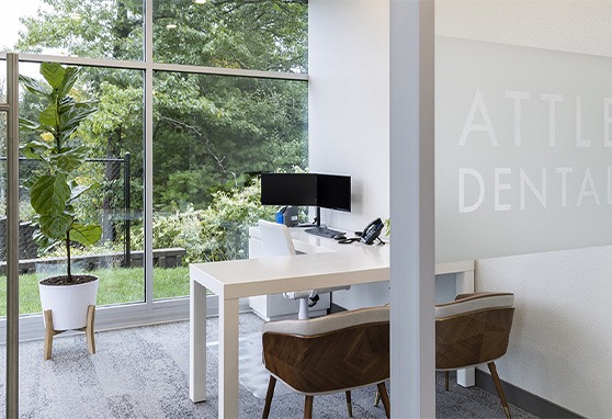 Consultation desk with a computer and two chairs