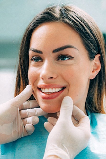 woman smiling after getting veneers in North Attleboro