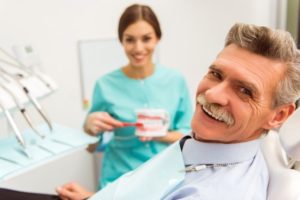 a patient receiving dentures to assist with jawbone preservation