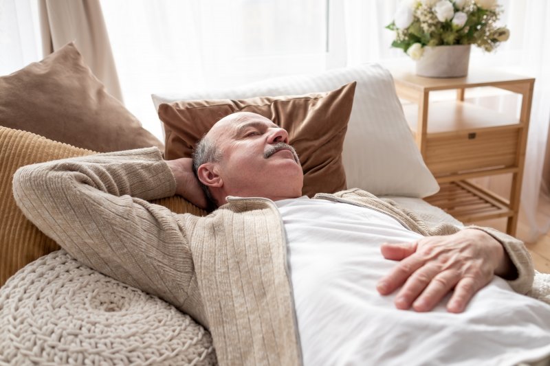 Man resting on couch