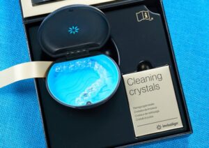 an Invisalign welcome kit with cleaning crystals